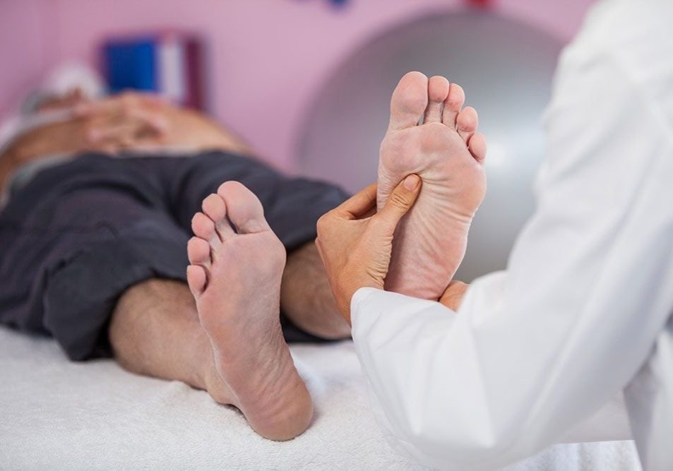 Senior-man-receiving-foot-massage